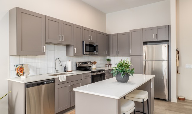 apartment kitchen countertops, sink, and appliances